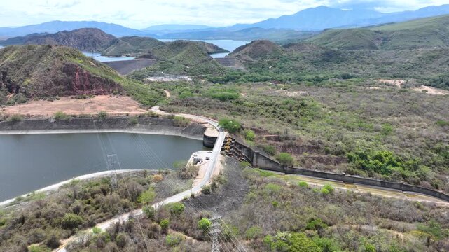 Betania Dam and Hydroelectric Reservoir in Huila, Colombia. Establishing Shot. Aerial View.