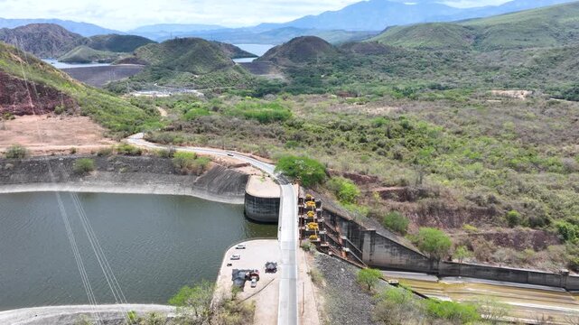 Betania Dam and Hydroelectric Reservoir in Huila, Colombia. Establishing Shot. Aerial View.