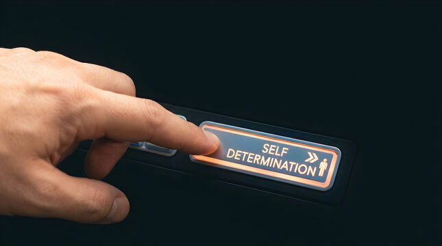 A human hand presses a glowing button labeled self determination on a dark background