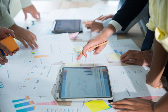 Business hands creating project financial charts and data mind map with colorful sticky notes