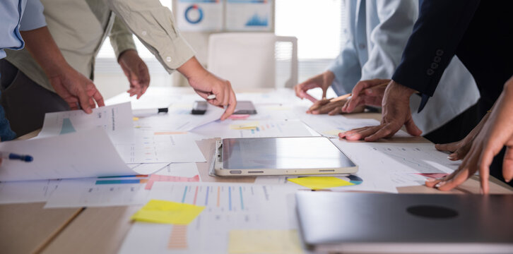 Business hands creating project financial charts and data mind map with colorful sticky notes