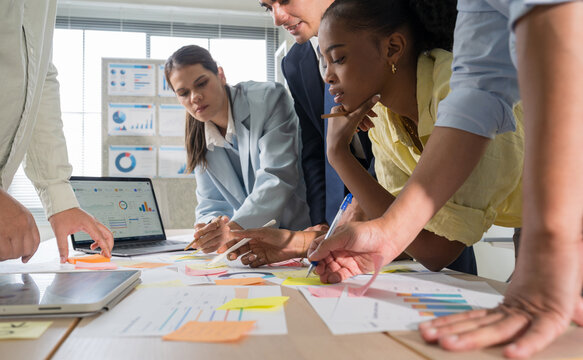 Business hands creating project financial charts and data mind map with colorful sticky notes