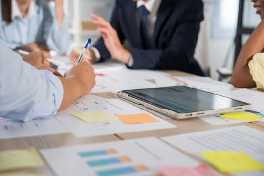 Business hands creating project financial charts and data mind map with colorful sticky notes