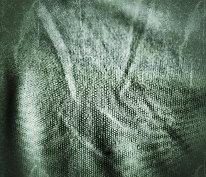 Close-up of white t-shirt fabric with fine knit detail, processed with a heavy grunge effect and desaturated green tones. Worn, distressed texture with faded streaks, subtle scratches, and a moody dar