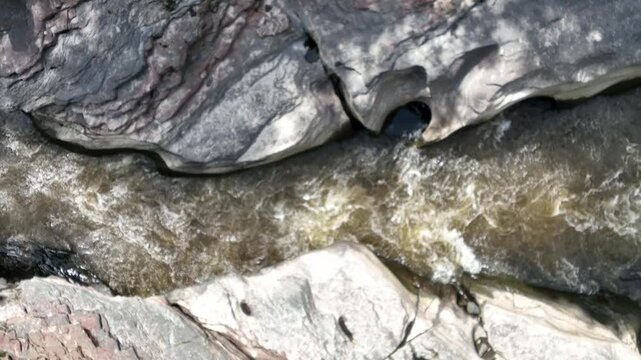 Estrecho del Magdalena River Rapids Surrounded by Rock Formations and Tropical Forest in Colombia. Slow Motion. Establishing Shot. Aerial View.