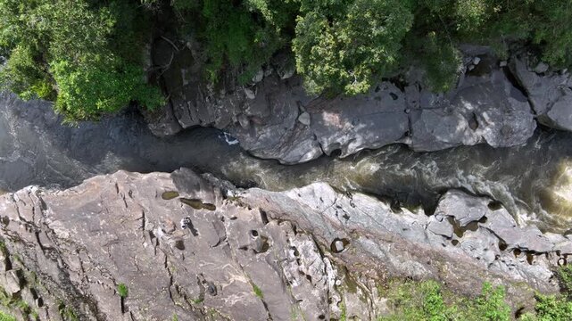 Estrecho del Magdalena River Rapids Surrounded by Rock Formations and Tropical Forest in Colombia. Slow Motion. Establishing Shot. Aerial View.