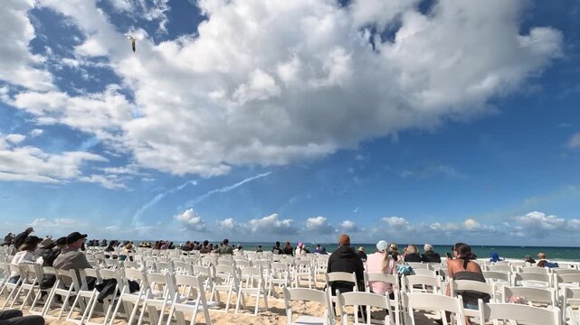 Spectators Watching Airshow Smoke Trails at Surfers Paradise Beach