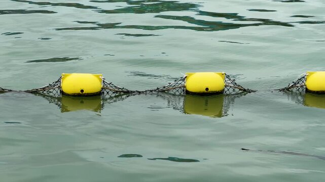 Yellow Safety Buoys Floating on Sea Water Surface