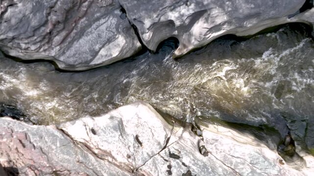 Magdalena River Flowing Through Estrecho del Magdalena Rock Formations in Colombia. Slow Motion. Establishing Shot. Aerial View.