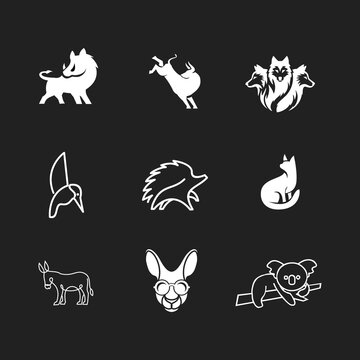 Animal logo collection: boar, three-headed dog, jumping goat, hummingbird, hedgehog, cat, donkey, koala, and kangaroo with glasses. Diverse set of stylized vector icons on a dark background.