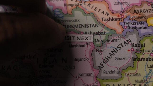 Visit Next label placed on map of Iran Middle East travel concept