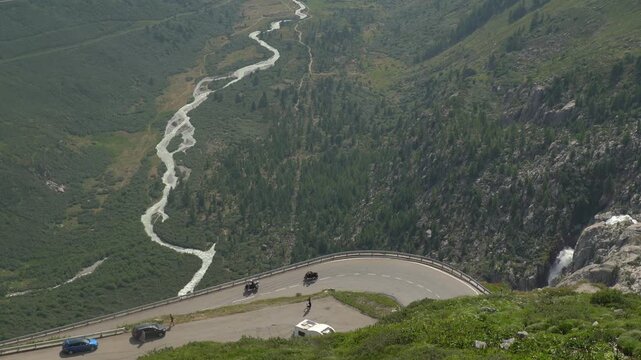 Motorcyclists Riding a Hairpin Turn on Furka Pass in the Swiss Alps