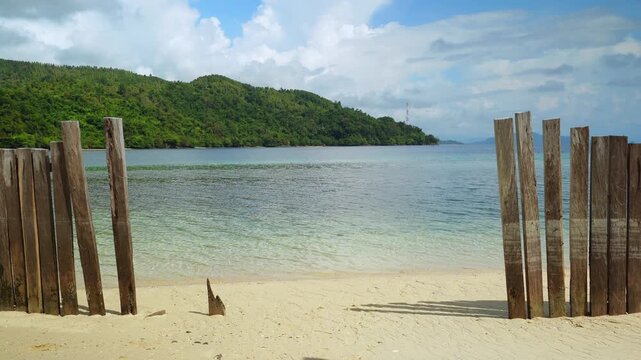 White Sand Beach Facing Calm Tropical Lagoon 4K