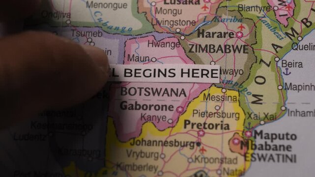 Travel Begins Here tag on map of Southern Africa for vacation planning