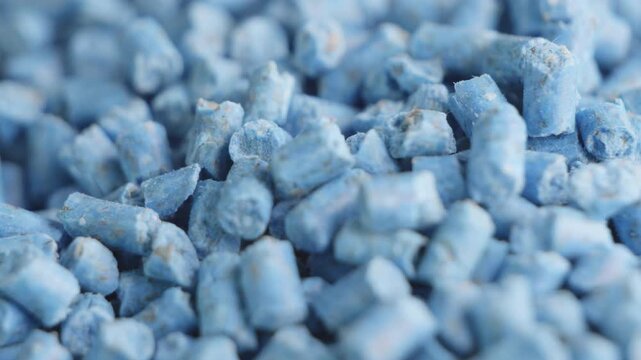 Blue slug snail killer pellets close up rotating camera motion stock footage