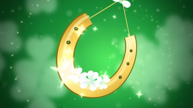 Close-up golden horseshoe with white clovers on bright green