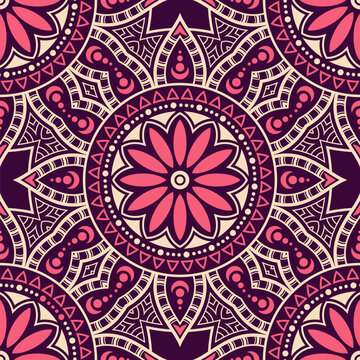 Seamless mandala floral vector pattern with intricate geometric ornaments in pink, purple and beige colors. Decorative ethnic background, perfect for textile, wallpaper, wrapping paper, fabric design.