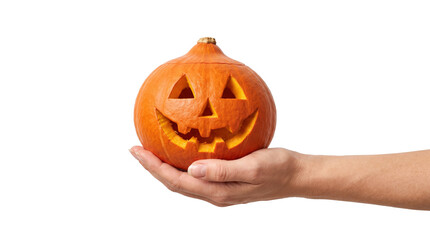 Obraz na płótnie Canvas Hand holding a carved orange halloween pumpkin jack-o-lantern