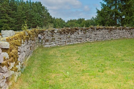 Dry stone wall, a traditional structure built without any mortar to hold the rocks together. Instead, the wall relies on the tight interlocking of carefully chosen stones and frictional gravity for it