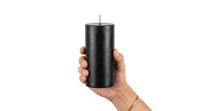 Hand holding solid black pillar candle