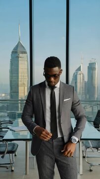 A Professional Businessman in a Modern Office Setting Checks His Watch Against the Stunning City Skyline, Emphasizing Elegance and Urgency