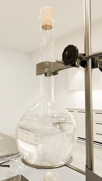 Round-bottom flask held in clamp stand filled with clear liquid