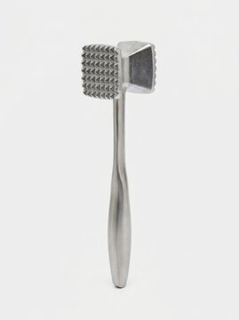 Metal meat tenderizer mallet standing vertically on a white background