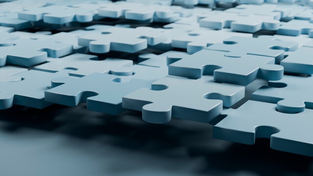 Blue interlocking puzzle pieces on flat surface