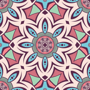 Seamless ethnic vector pattern with stylized floral mandalas in coral, mint, and blue colors. Retro bohemian vector background. Decorative endless color mandala pattern.
