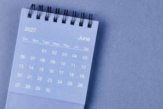 June 2027 Monthly desk calendar for 2026 year on blue background.