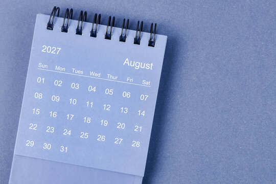 August 2027 Monthly desk calendar for 2026 year on blue background.