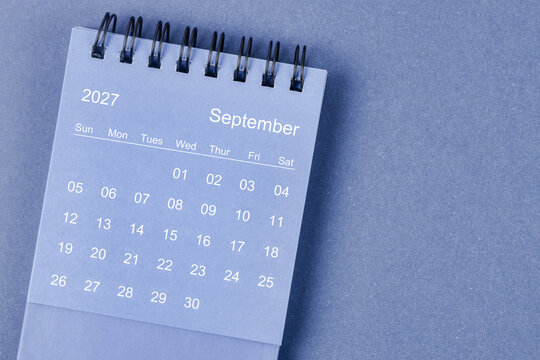 September 2027 Monthly desk calendar for 2026 year on blue background.