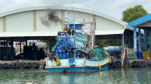 Fishing Boat Emits Black Exhaust Smoke at Harbor Dock
