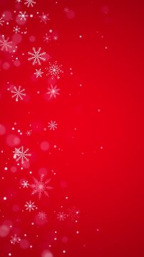 christmas snowflakes and shiny glitter stars on red pattern animation, christmas and new year holiday vertical social media motion background
