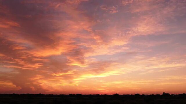 Stunning colorful sunset sky with vibrant orange and purple clouds.