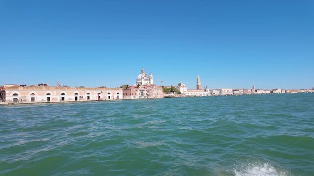 Venice Lagoon waterfront with historic buildings and church