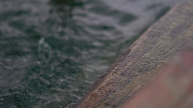 Close-up of water splashing in a sauna during a summer day