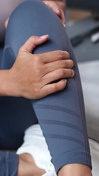 Women while exercising touching painful twisted or broken. Athlete training, running up and down stairs accident. Sport sprained sprain cause injury knee. and pain with leg bones.