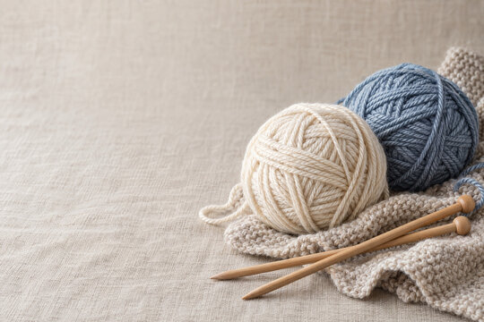 Soft yarn balls and knitting needles