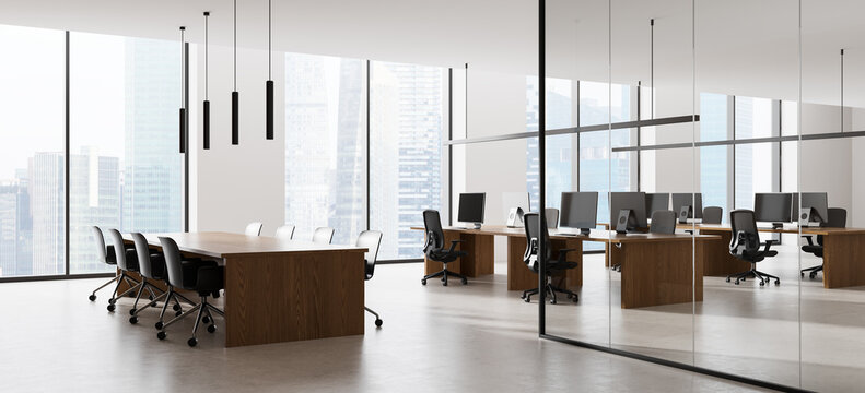 Contemporary corporate office interior with wood conference table, glass meeting room, computers, pendant lights, and city skyline view. 3D Rendering
