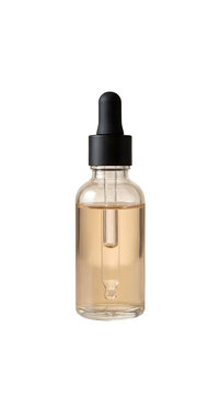 A sophisticated clear glass dropper bottle holds a golden liquid ideal for luxurious beauty skincare aromatherapy and wellness product presentations isolated on
