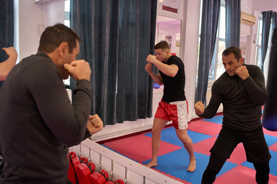 Kickboxers practicing hook and uppercut