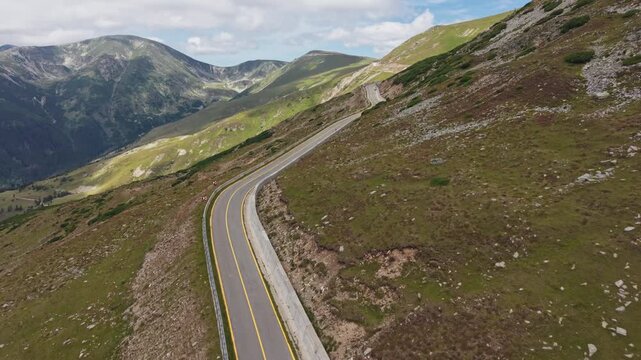 Transalpina Highway Traversing Steep Ridge