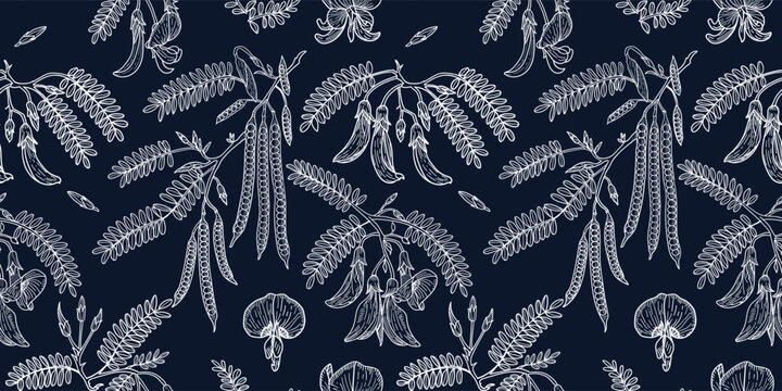 Indigo batik style seamless pattern design with tropical sesbania flower and leaves on dark navy background