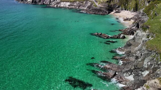 Coumeenoole Beach reveal with turquoise water and dramatic cliffs