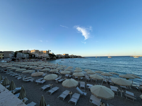 Beautiful scenic view of the ancient fortified historic center of Otranto with white houses overlooking the crystal clear turquoise Adriatic sea. Famous travel destination in Salento, Apulia, Southern