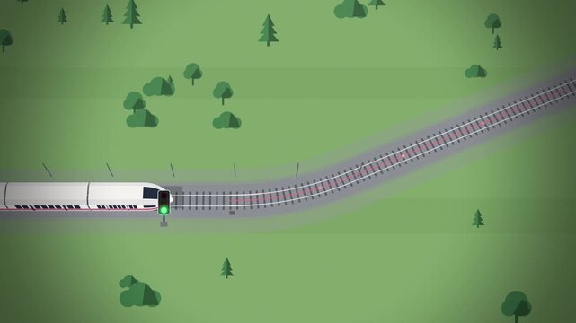 Red striped train taking diverging track at railway switch top view