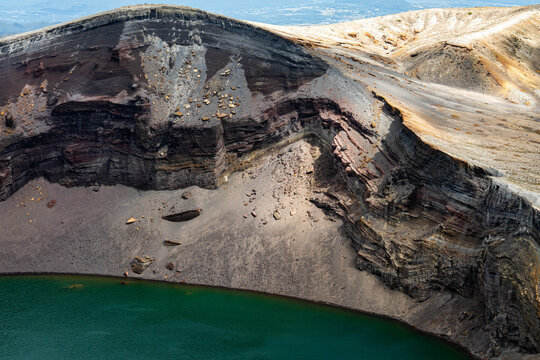 Slanting Sunlight Revealing the Layers of Okama's Crater Wall