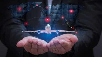 Confident businessman holds digital air traffic network connecting global flight routes for international aviation logistics concept © Piya W.