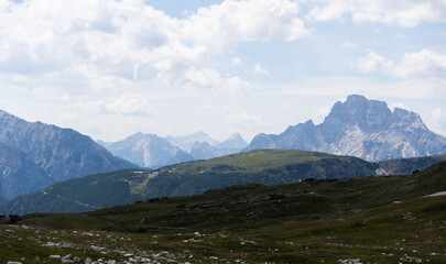 Naklejka premium Mountain landscape panorama Tre Cime Mount against a blue summer background. 